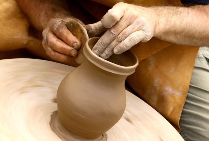 potter-making-clay-jug-s